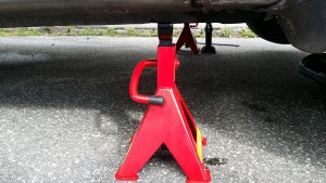 jack stand fitted beneath car